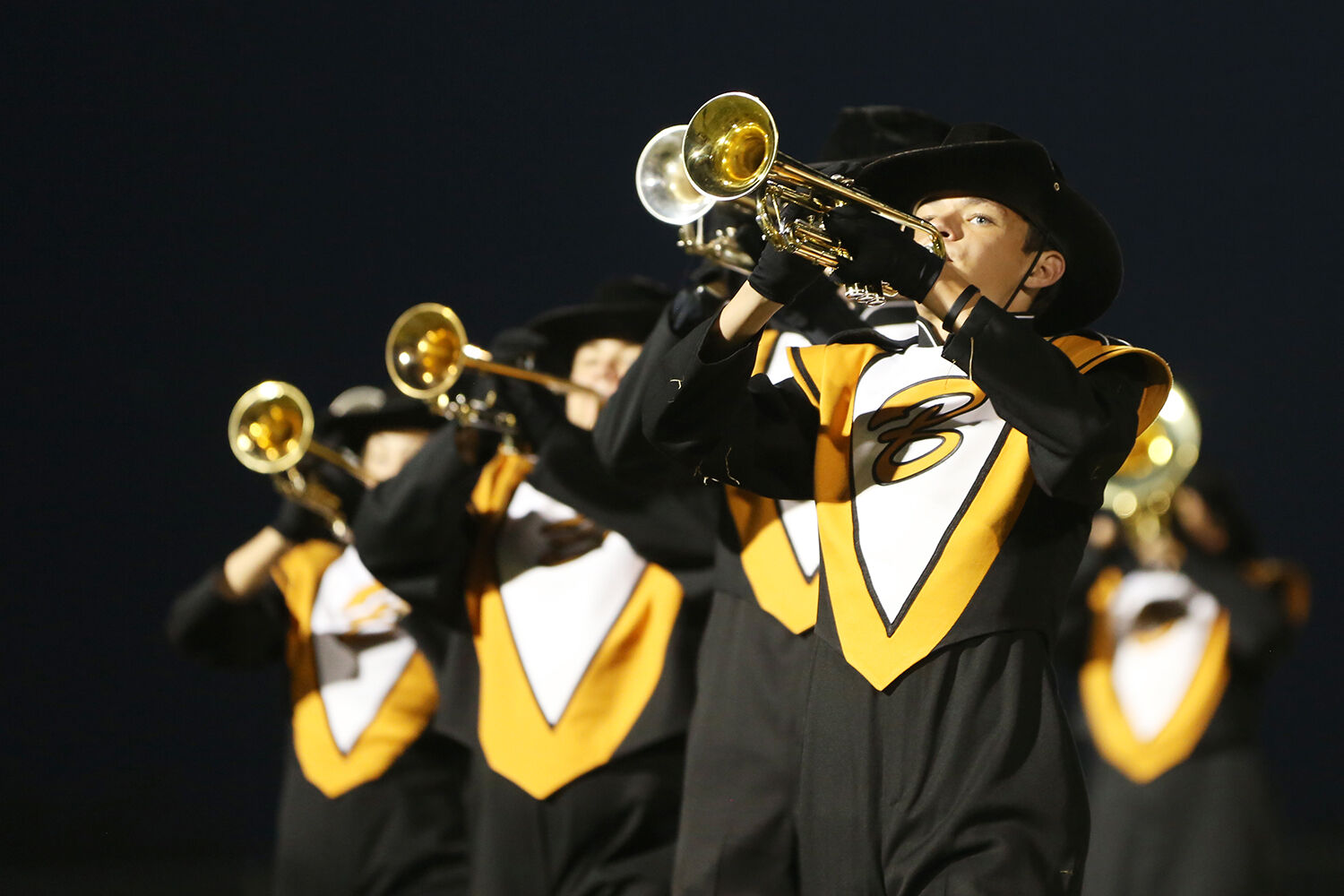 Carter Redden stands at the front of the trumpets during the band’s performance